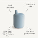 Mushie Silicone Sippy Cup in powder blue, featuring leak-resistant and dishwasher-safe design, made from 100% food-grade silicone.