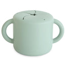 Silicone snack cup in Cambridge Blue, featuring a round shape and two handles, designed for toddlers.