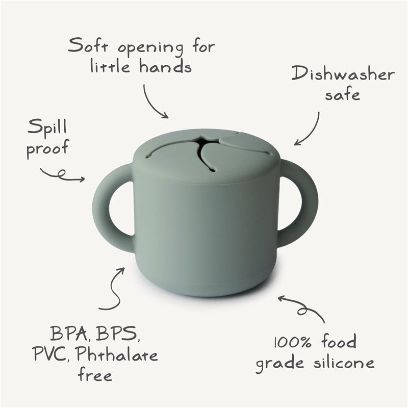 Mushie Silicone Snack Cup in Cambridge Blue, featuring a spill-proof design, soft opening, and dishwasher safe, made from food-grade silicone.