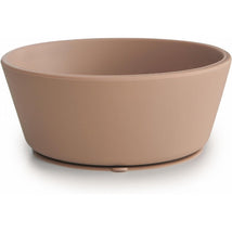 Silicone suction bowl in natural color, designed for babies, featuring a wide, stable base for easy attachment to surfaces.