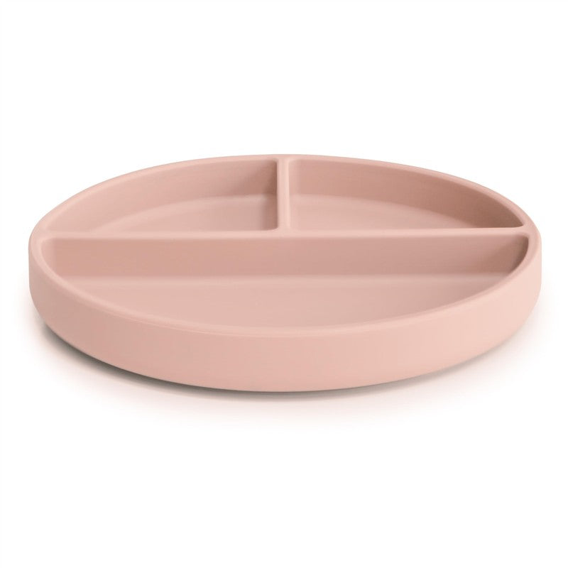 Silicone suction plate in blush color featuring three divided compartments for serving food.