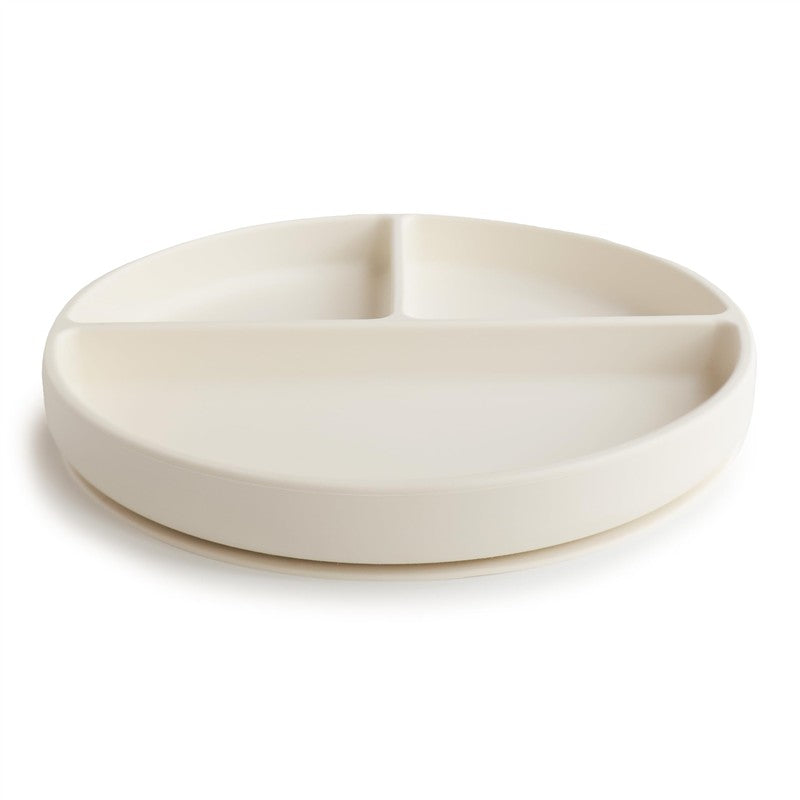 Silicone suction plate in ivory color, featuring three divided sections for portioning food.
