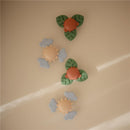 Brightly colored Mushie Sunshine Suction Spinner Toy featuring sun and cloud designs, perfect for sensory play.