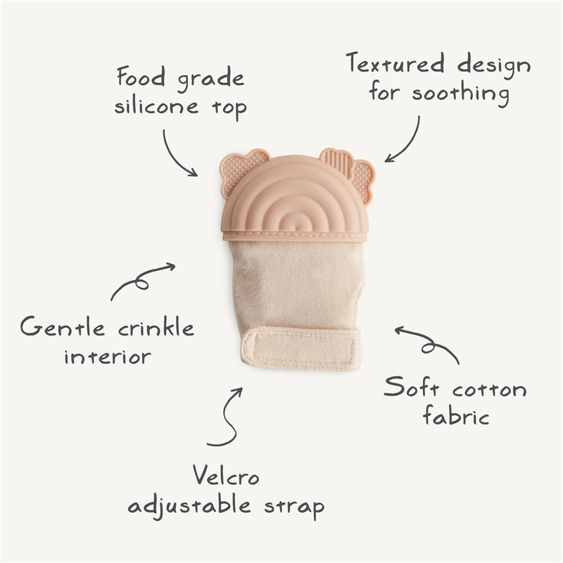 Mushie Silicone Teething Mitten in rainbow colors features a food-grade silicone top, soft cotton interior, and adjustable Velcro strap.