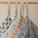 Water-resistant wet bags in blue floral patterns, featuring zip closures and fabric loops for easy hanging.