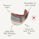 Mushie Whale Bath Stackers in pastel colors, designed for scooping and pouring; stackable for easy storage. 100% made in Denmark, BPA-free.