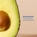 Sliced avocado showcasing the seed, with text highlighting avocado perseose® as a moisturizing ingredient for delicate skin.