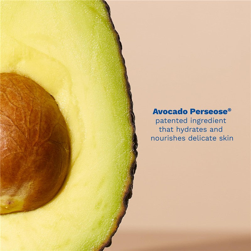 Half of a ripe avocado with a visible seed and text highlighting Avocado Perseose®, an ingredient that hydrates delicate skin.