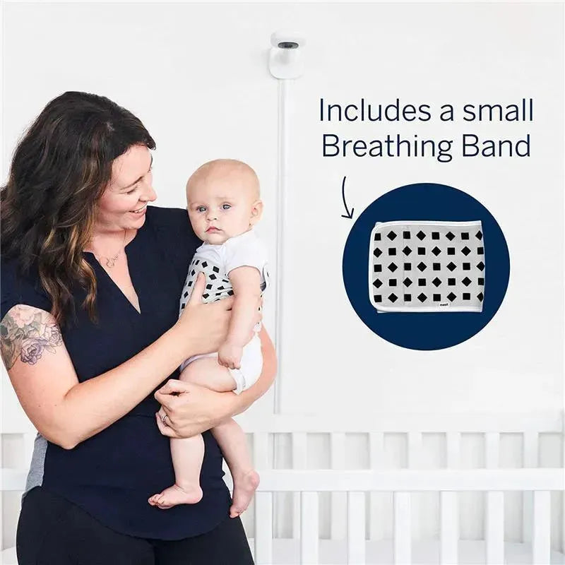 Nanit Pro Camera mounted on a wall with a mother holding a baby, featuring a small Breathing Band graphic.