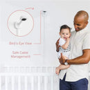 Nanit Pro Camera mounted on the wall, with a father holding a smiling baby, showcasing safe cable management and bird’s-eye view features.
