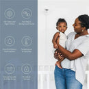 Nanit Pro Camera mounted on a wall beside a smiling woman holding a baby, highlighting features like HD video and audio.