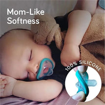 Pink NanoBebe 2-Pack Flexy Pacifiers being held by a sleeping baby, highlighting mom-like softness and 100% silicone material.