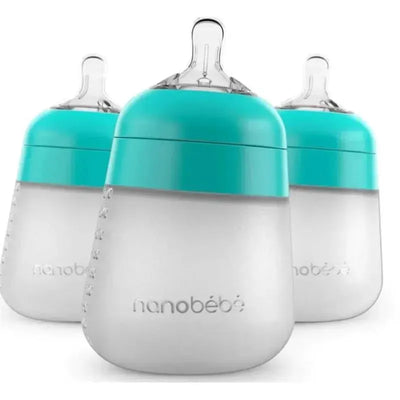 Three teal and clear Nanobebe 9oz Flexy Silicone baby bottles are displayed side by side.