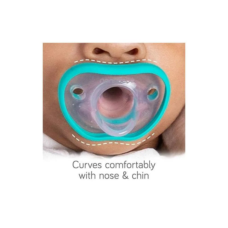 Flexy pacifier by Nanobebe in white, designed for 0-3 months, shown fitting comfortably with baby’s mouth, nose, and chin.