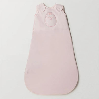 Soft pink Nested Bean Zen Sack Classic for infants, featuring a subtle bow and heart design, suitable for 3 to 6 months.