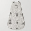 Grey sleeping sack with black triangular patterns and a bird design, labeled Nested Bean Zen Sack Classic Tog 0.5.