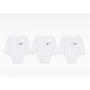 Three white long sleeve bodysuits from Nike, featuring a black logo on the left side of each.