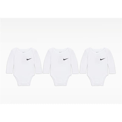 Three white long sleeve bodysuits from Nike, featuring a black logo on the left side of each.