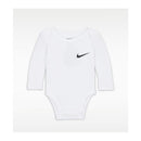 Long sleeve white bodysuit for babies featuring a black Nike logo on the chest.