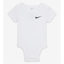 White Nike baby bodysuit featuring a black Nike logo, designed for newborns with short sleeves and a snap closure.