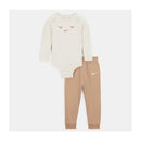 Nike Baby Set featuring a long-sleeve bodysuit with a heart design and tan pants with a Nike logo.