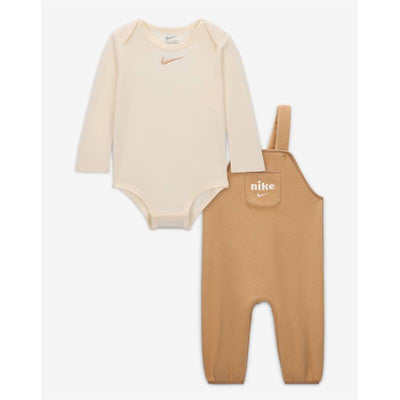 Nike Kids Fleece Overall in hemp color with long-sleeve beige bodysuit, featuring the Nike logo on both pieces.