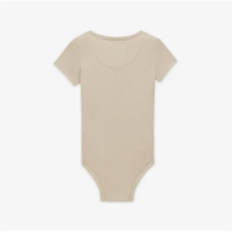 Nike Readyset bodysuit in Birch Heather, featuring short sleeves and a fitted design in a light beige color.