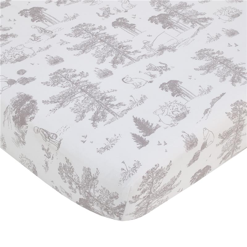 Taupe crib sheet featuring classic Disney characters Winnie the Pooh, Piglet, and Eeyore among trees and nature scenes.