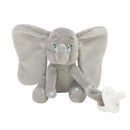 Gray plush Dumbo elephant holding a white pacifier, designed as a comfort buddy for infants.