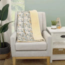 Super soft baby blanket featuring Disney’s Lion King Simba design with a Sherpa backing, displayed on a chair.