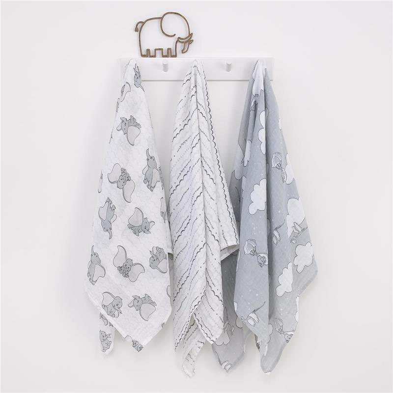 Dumbo-themed muslin swaddles in gray and white, featuring elephant prints and cloud patterns, hanging on a wall hook.