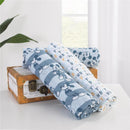 Three printed muslin swaddles featuring Mickey Mouse designs, displayed on a vintage box.