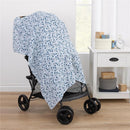 Mickey Mouse printed muslin swaddle draped over a stroller, showcasing a blue design with cartoon mickey faces.