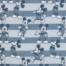 Blue and white striped muslin fabric featuring multiple Mickey Mouse cartoon designs in various poses.