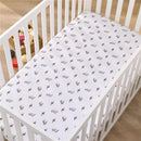White crib sheet featuring Harry Potter-themed designs, including glasses, lightning bolts, and owls.