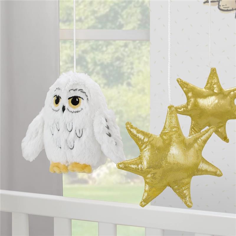 Musical mobile featuring a plush white owl with yellow accents and two shiny golden stars, designed for nursery decor.