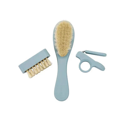 Baby grooming kit in Lily Blue color, including a main brush, a smaller brush, and nail clippers.