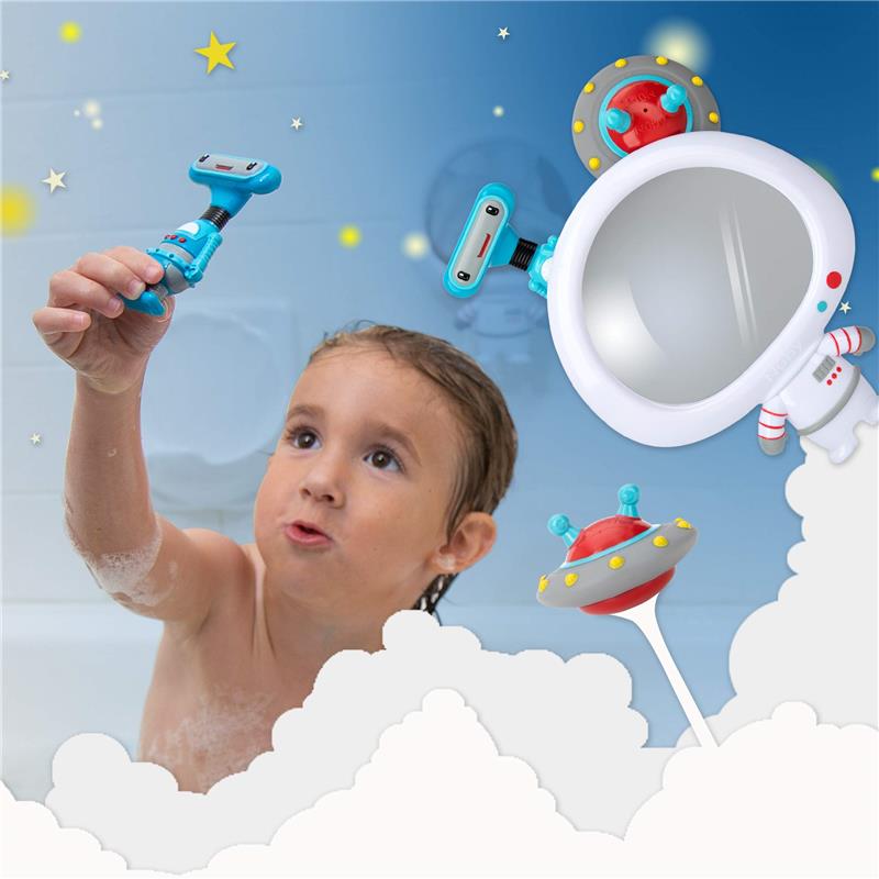 A child in a bathtub examines a blue astronaut mirror toy, surrounded by whimsical space-themed floating toys.