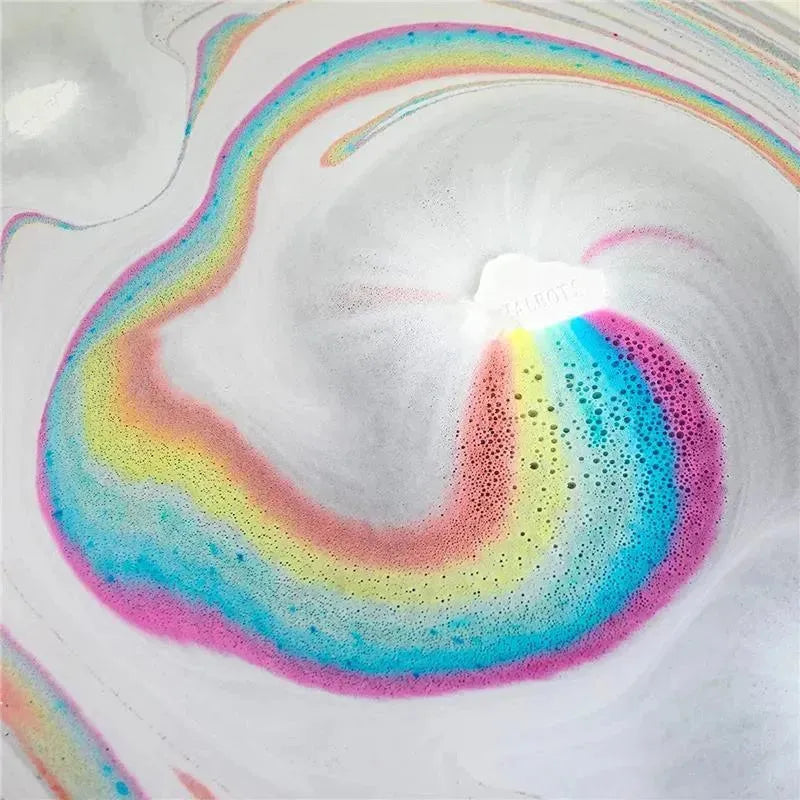 Colorful bath fizzy swirling in water, creating a rainbow effect with foamy bubbles.