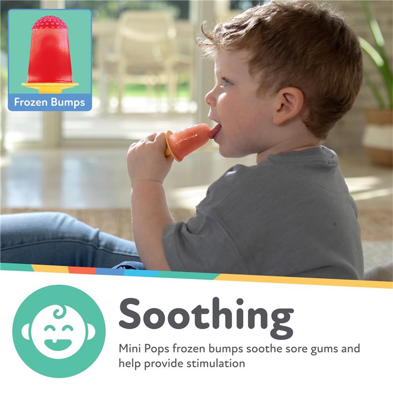 Toddler enjoying a silicone popsicle mold, tasting a red frozen treat to soothe sore gums.