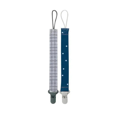 Two fabric pacifier clip holders featuring a gray plaid design and a blue star pattern, each with a plastic clip.
