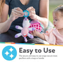 Nuby Calming Natural Flex Snuggleez Pacifier with plush penguin, demonstrating ease of use with a parent and child.