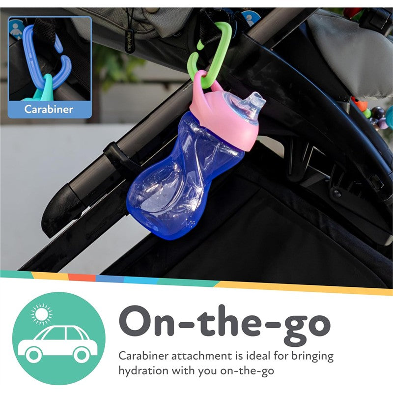 Nuby Clik-It Soft Spout Cup in blue with pink lid, attached via carabiner to a stroller, emphasizing on-the-go hydration.