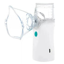 Portable nebulizer with a clear mouthpiece, white casing, and green power button for respiratory treatment.