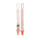 Two fabric pacifier clips for girls, one with a rainbow design and the other with heart patterns, featuring plastic clips.
