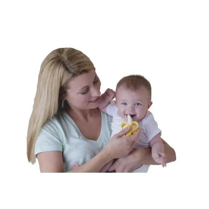 Mother holds a smiling baby with a Nuby Nana Nubs Gum Massager Teether in their hand, promoting dental health.