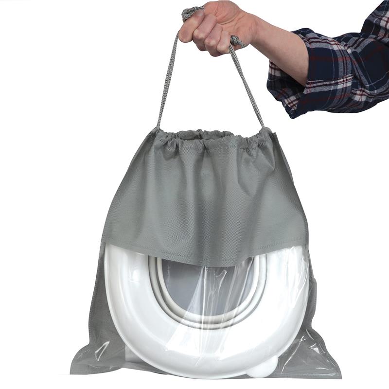 Portable potty seat in a gray carrying bag, held by a hand, designed for travel convenience.