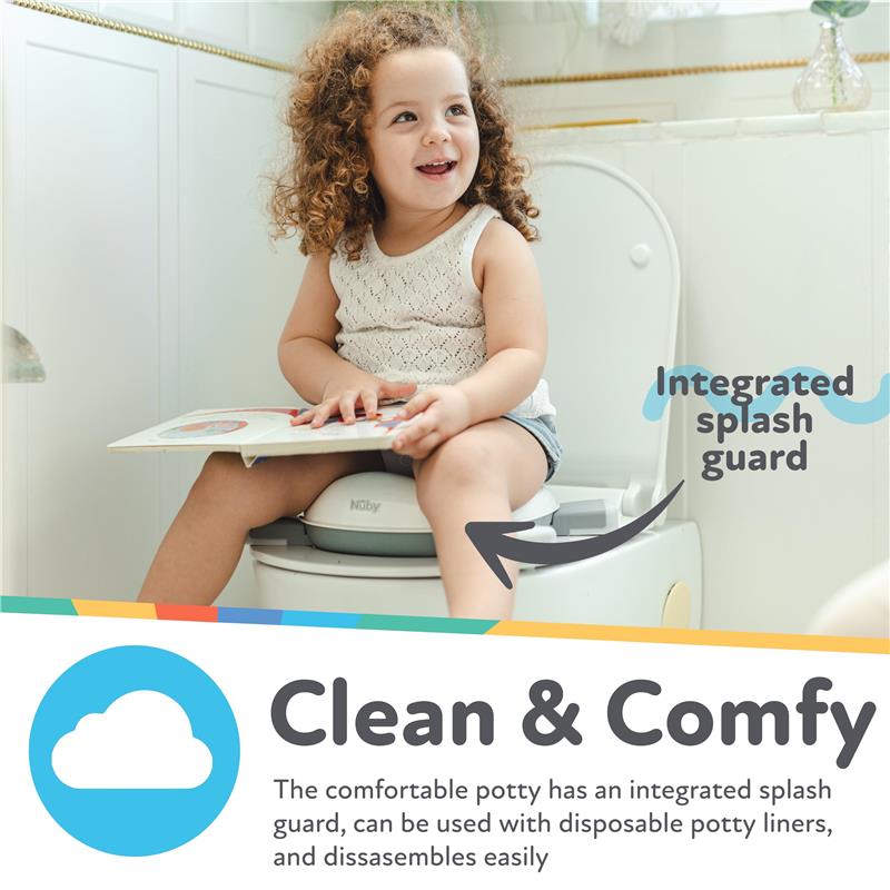 A young girl sits on a Nuby portable potty seat, smiling and holding a book, showcasing its integrated splash guard.