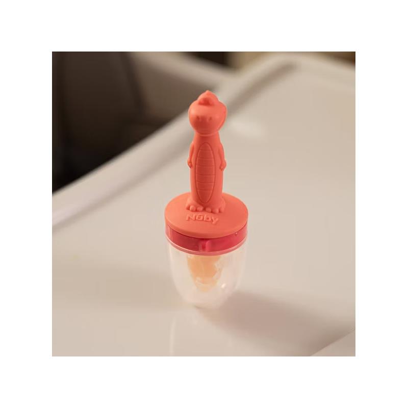 Silicone feeder with a playful crocodile design, allowing babies to safely enjoy solid foods.