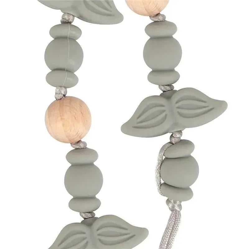Silicone pacifier clip featuring mustache shapes and wooden beads, designed to keep pacifiers accessible for infants.